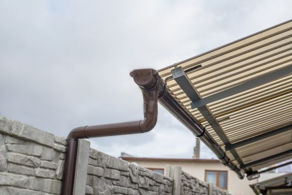 Plastic Downspout Installation in Rogers
